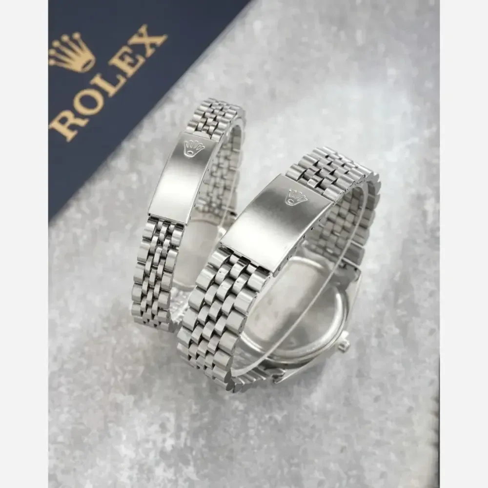 ساعت مچی رولکس مدل بند استیل نقره ای صفحه آبی دارای روزشمار و تقویم تلسکوپی
