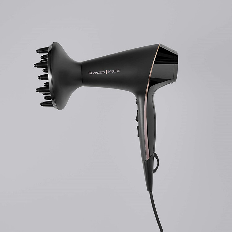 سشوار حرفهای 2400 وات رمینگتون مدل AC9140B Proluxe، موتور AC، وزن 300 گرم، دارای سری متمرکزکننده با ویژگی صافکنندگی، با قابلیت باد سرد، عملکرد توربو، فناوری تولید یون