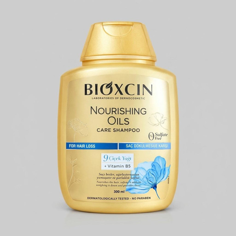 شامپو تقویت‌کننده و ترمیم‌کننده مو بیوکسین مدل Nourishing Oils Care حجم 300 میلی‌لیتر، مناسب انواع مو، فاقد سولفات و پارابن، حاوی 9 نوع روغن گیاهی و ویتامین B5، ملایم و مغذی